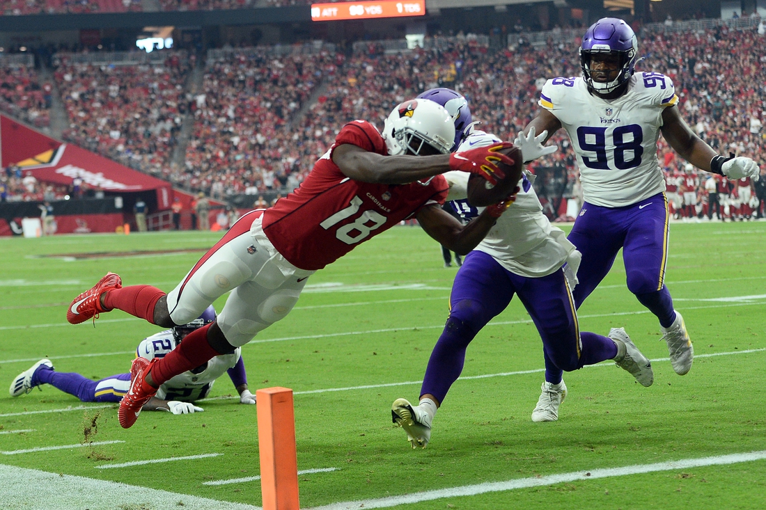Sep 19, 2021; Glendale, Arizona, USA; Arizona Cardinals wide receiver A.J. Green (18) dives for a touchdown against the Minnesota Vikings during the second half at State Farm Stadium. Mandatory Credit: Joe Camporeale-USA TODAY Sports