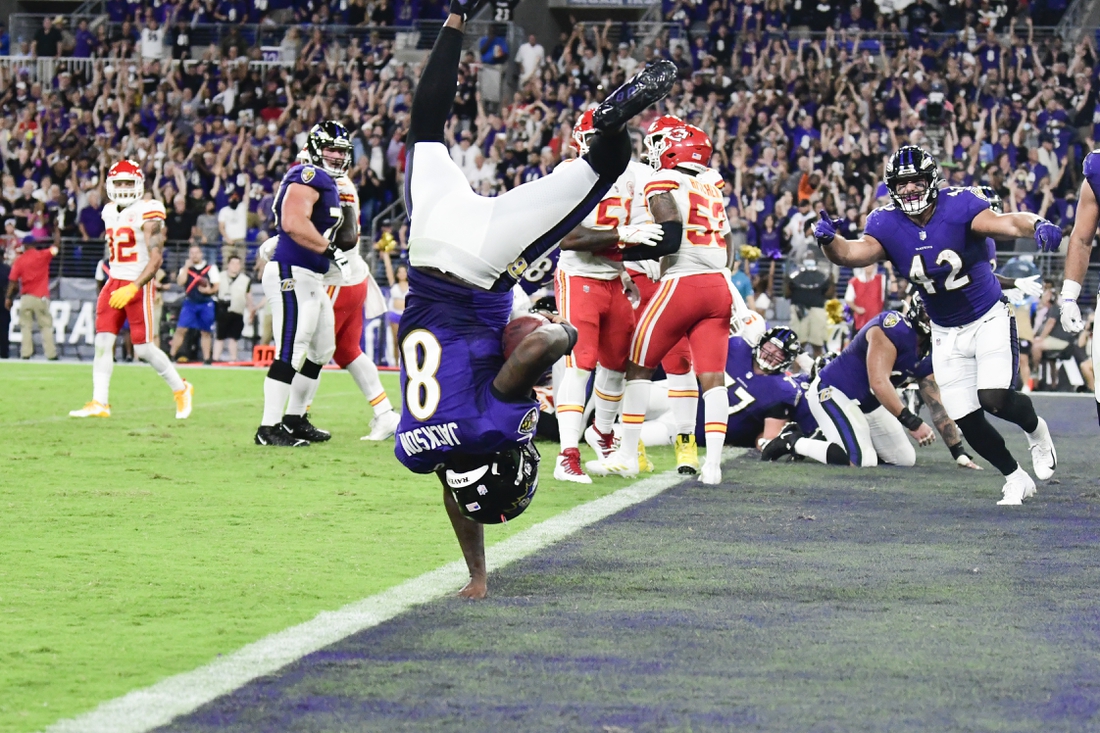 Sep 19, 2021; Baltimore, Maryland, USA;  Baltimore Ravens quarterback Lamar Jackson (8) flips into the end zone for  a fourth quarter touchdown  against the Kansas City Chiefs at M&T Bank Stadium. Mandatory Credit: Tommy Gilligan-USA TODAY Sports