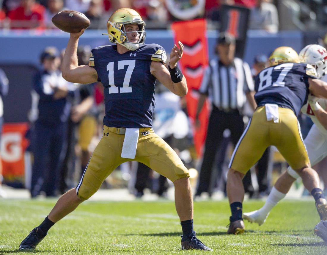Sep 25, 2021; Chicago, Illinois, USA; Notre Dame Fighting Irish quarterback Jack Coan (17) passes during the first half against the Wisconsin Badgers at Soldier Field. Mandatory Credit: Patrick Gorski-USA TODAY Sports