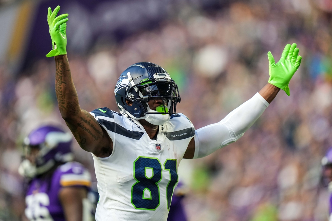 Sep 26, 2021; Minneapolis, Minnesota, USA; Seattle Seahawks tight end Gerald Everett (81) celebrates a touchdown scored by running back Chris Carson (not pictured) during the second quarter against Minnesota Vikings at U.S. Bank Stadium. Mandatory Credit: Brace Hemmelgarn-USA TODAY Sports