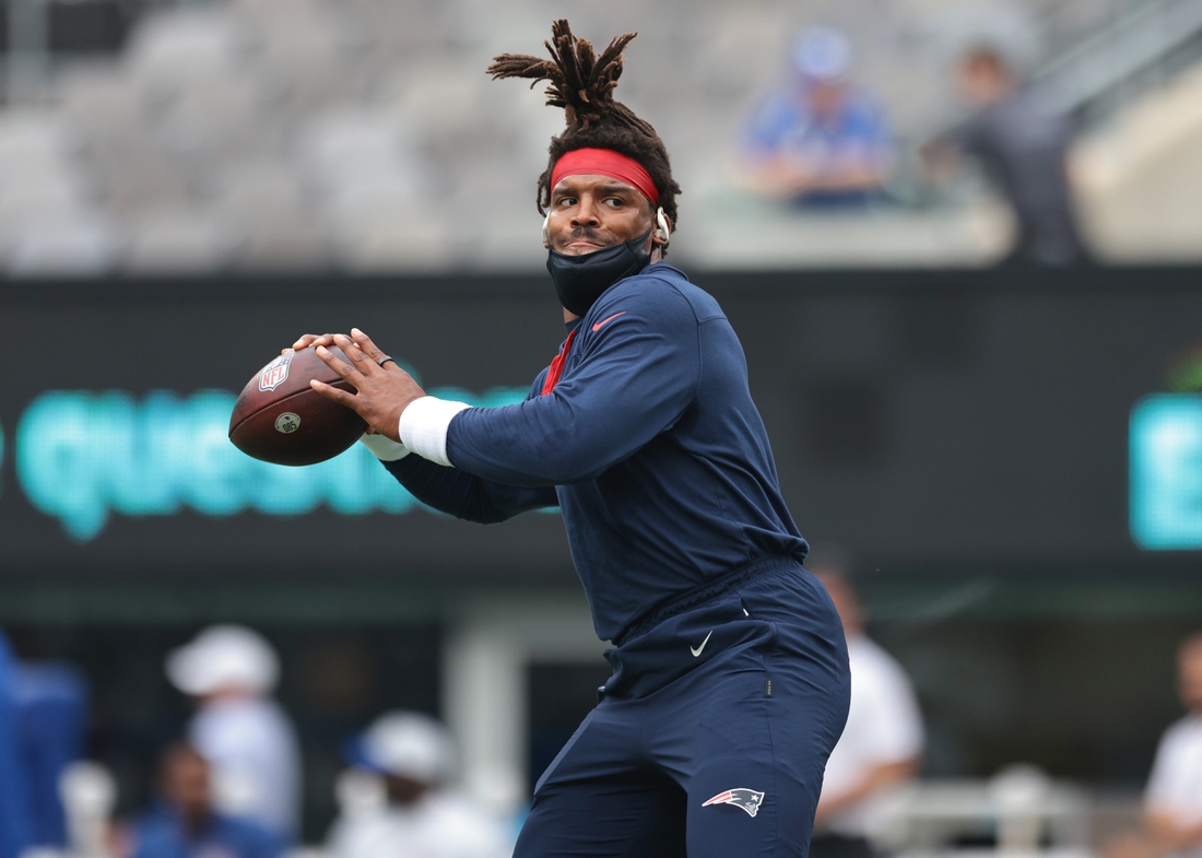 Aug 29, 2021; East Rutherford, New Jersey, USA; New England Patriots quarterback Cam Newton (1) throws the ball prior to the game against the New York Giants at MetLife Stadium. Mandatory Credit: Vincent Carchietta-USA TODAY Sports