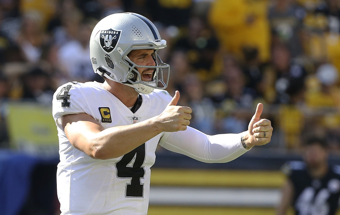 Sep 19, 2021; Pittsburgh, Pennsylvania, USA;  Las Vegas Raiders quarterback Derek Carr (4) gestures on the field against the Pittsburgh Steelers during the fourth quarter at Heinz Field. Las Vegas won 26-17. Mandatory Credit: Charles LeClaire-USA TODAY Sports