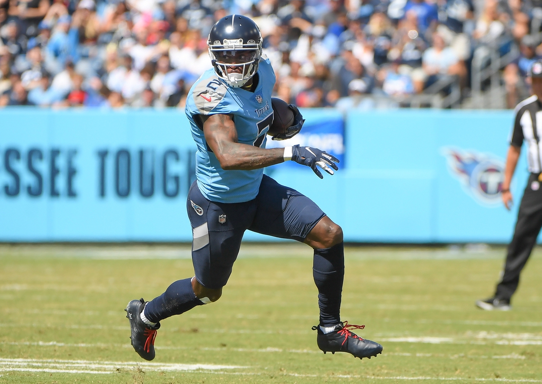 Sep 26, 2021; Nashville, Tennessee, USA;  Tennessee Titans wide receiver Julio Jones (2) runs the ball during the first half at Nissan Stadium. Mandatory Credit: Steve Roberts-USA TODAY Sports