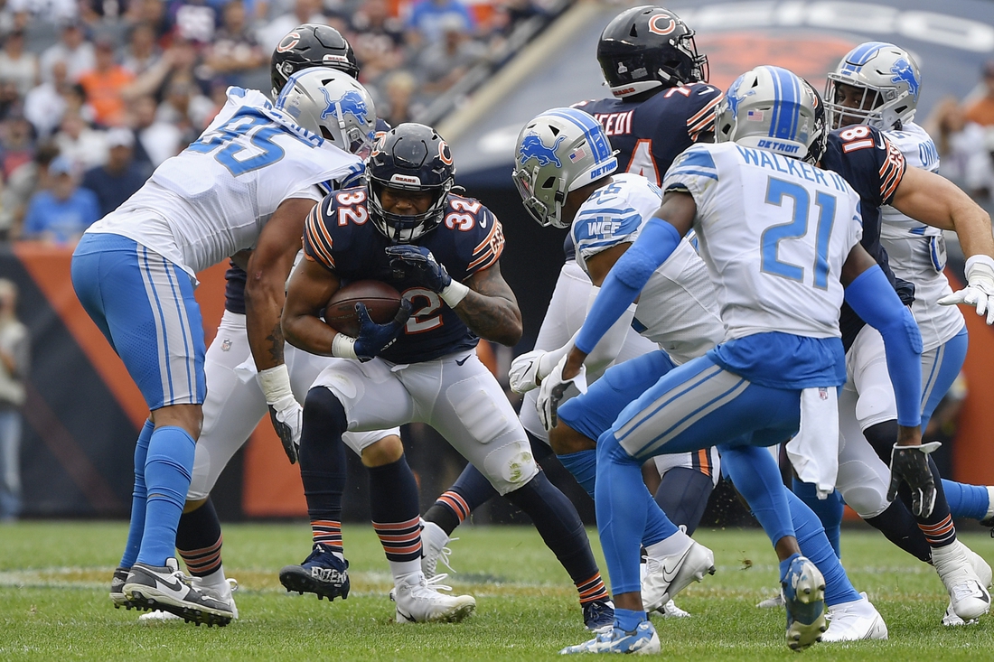 Oct 3, 2021; Chicago, Illinois, USA; Chicago Bears running back David Montgomery (32) runs with the football in the first half against the Detroit Lions at Soldier Field. Mandatory Credit: Quinn Harris-USA TODAY Sports