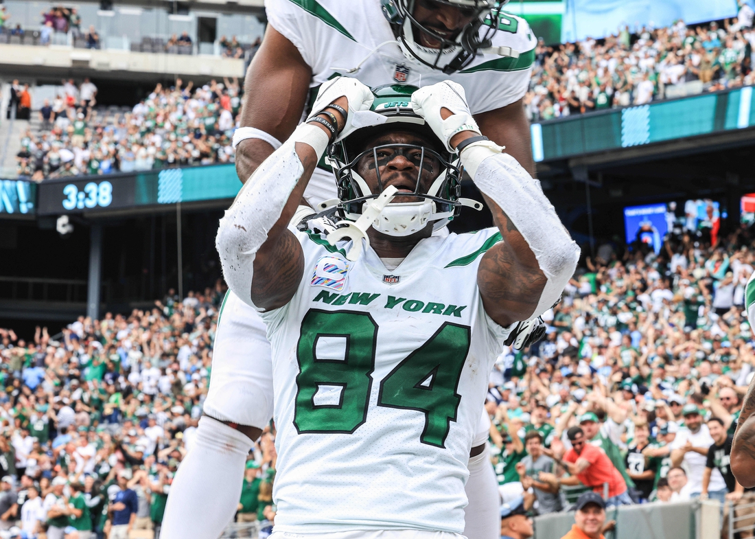 Oct 3, 2021; East Rutherford, New Jersey, USA; New York Jets wide receiver Corey Davis (84) reacts after his touchdown  reception during the second half against the Tennessee Titans at MetLife Stadium. Mandatory Credit: Vincent Carchietta-USA TODAY Sports