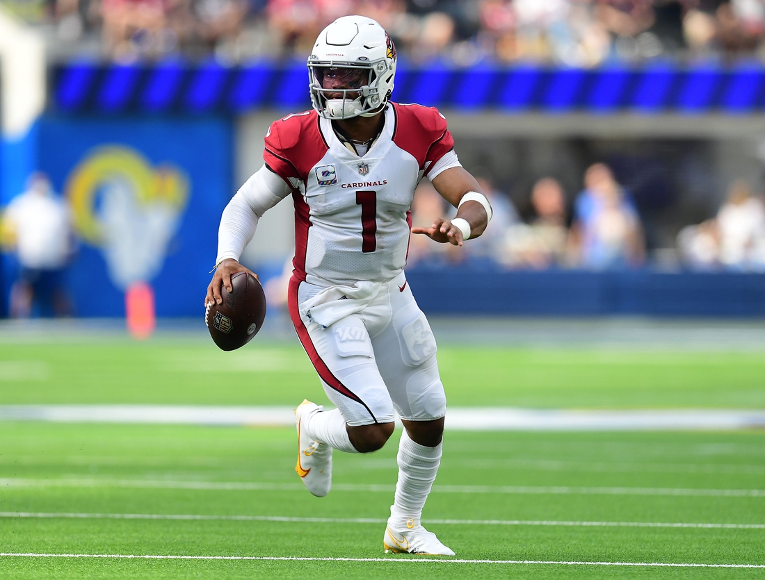 Oct 3, 2021; Inglewood, California, USA; Arizona Cardinals quarterback Kyler Murray (1) moves out to pass against the Los Angeles Rams during the first half at SoFi Stadium. Mandatory Credit: Gary A. Vasquez-USA TODAY Sports