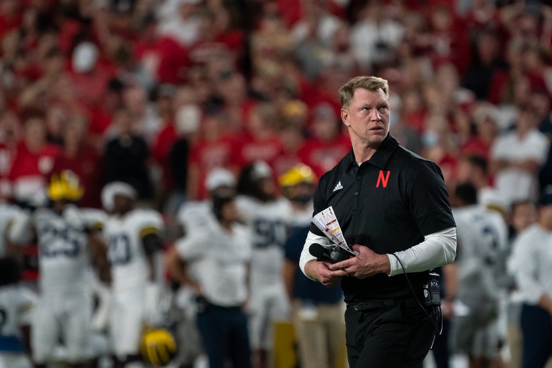 Oct 9, 2021; Lincoln, Nebraska, USA; Nebraska Cornhuskers head coach Scott Frost walks off the field after an injury timeout following a play against the Michigan Wolverines during the fourth quarter at Memorial Stadium. Mandatory Credit: Dylan Widger-USA TODAY Sports
