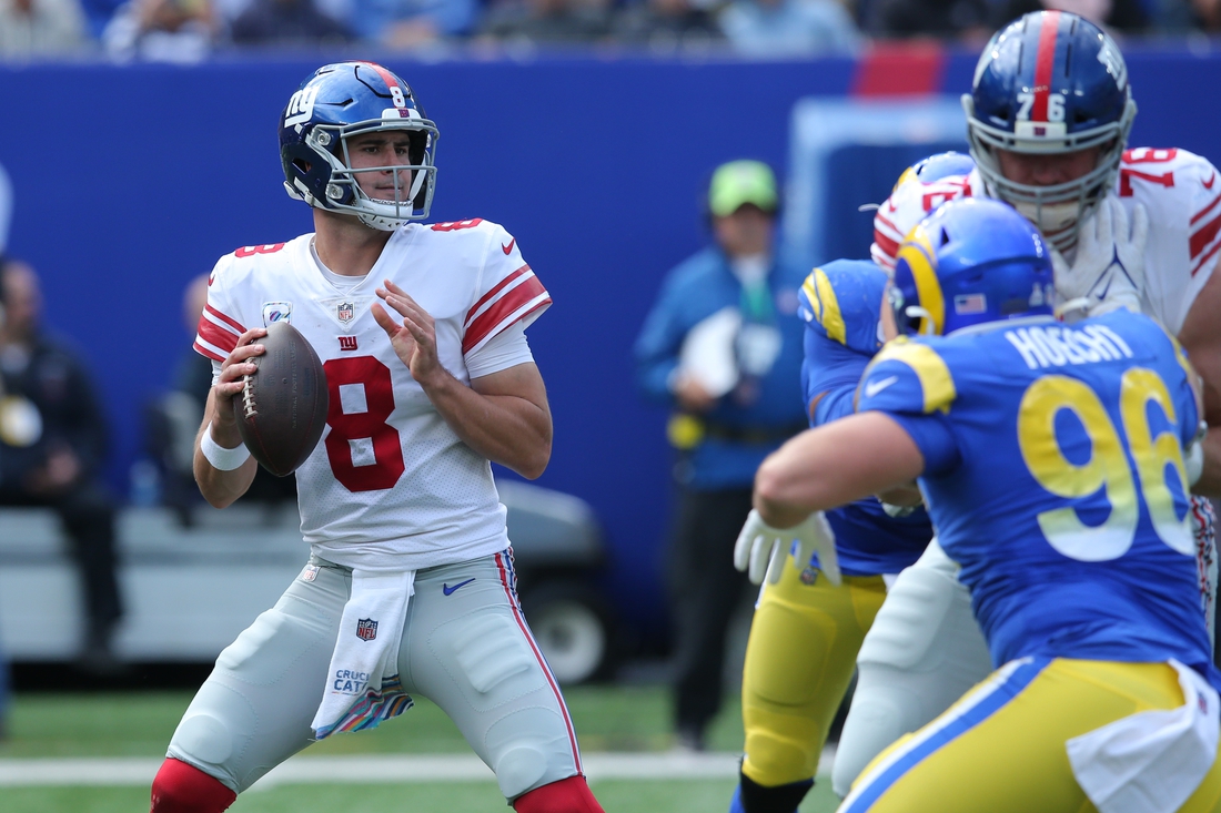 Oct 17, 2021; East Rutherford, New Jersey, USA; New York Giants quarterback Daniel Jones (8) drops back to pass against the Los Angeles Rams during the second quarter at MetLife Stadium. Mandatory Credit: Brad Penner-USA TODAY Sports