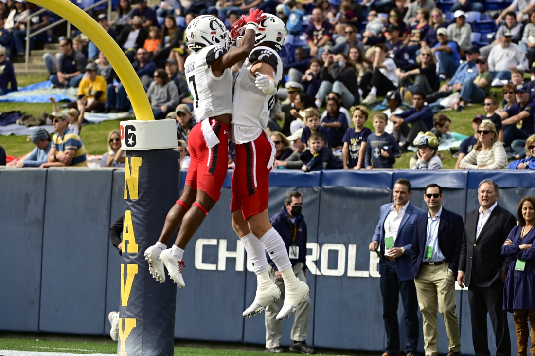 Oct 23, 2021; Annapolis, Maryland, USA; Cincinnati Bearcats tight end Josh Whyle (81)  celebrates with  wide receiver Tre Tucker (7) after scoring a first quarter touchdown against the Navy Midshipmen  at Navy-Marine Corps Memorial Stadium. Mandatory Credit: Tommy Gilligan-USA TODAY Sports