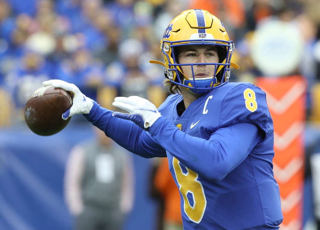 Oct 23, 2021; Pittsburgh, Pennsylvania, USA;  Pittsburgh Panthers quarterback Kenny Pickett (8) passes the ball against the Clemson Tigers during the first quarter at Heinz Field. Mandatory Credit: Charles LeClaire-USA TODAY Sports