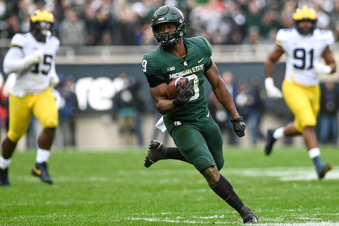 Michigan State's Kenneth Walker III runs for a touchdown against Michigan during the fourth quarter on Saturday, Oct. 30, 2021, at Spartan Stadium in East Lansing.

211030 Msu Michigan 185a