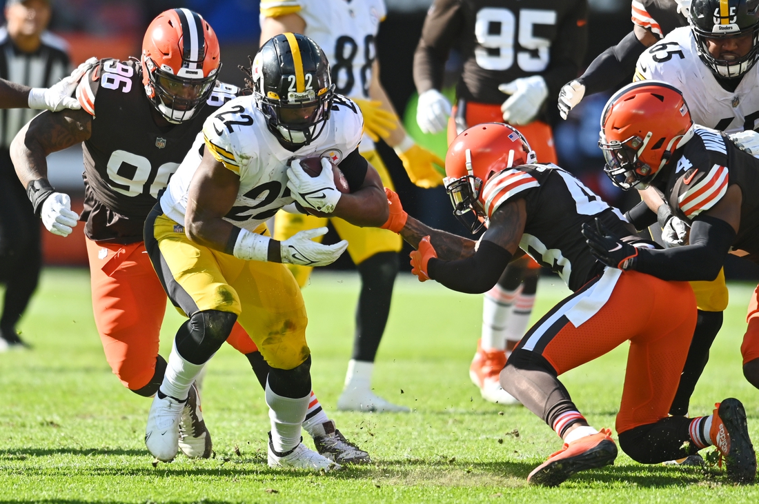 Oct 31, 2021; Cleveland, Ohio, USA; Pittsburgh Steelers running back Najee Harris (22) runs with the ball as Cleveland Browns defensive tackle Jordan Elliott (96) and free safety John Johnson (43) defend during the first half at FirstEnergy Stadium. Mandatory Credit: Ken Blaze-USA TODAY Sports