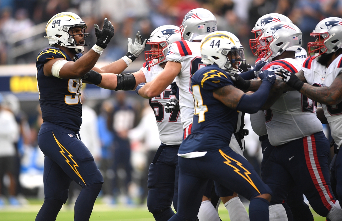 Oct 31, 2021; Inglewood, California, USA; Los Angeles Chargers defensive tackle Jerry Tillery (99) gestures towards the New England Patriots offense after a play in the first half at SoFi Stadium. Mandatory Credit: Orlando Ramirez-USA TODAY Sports