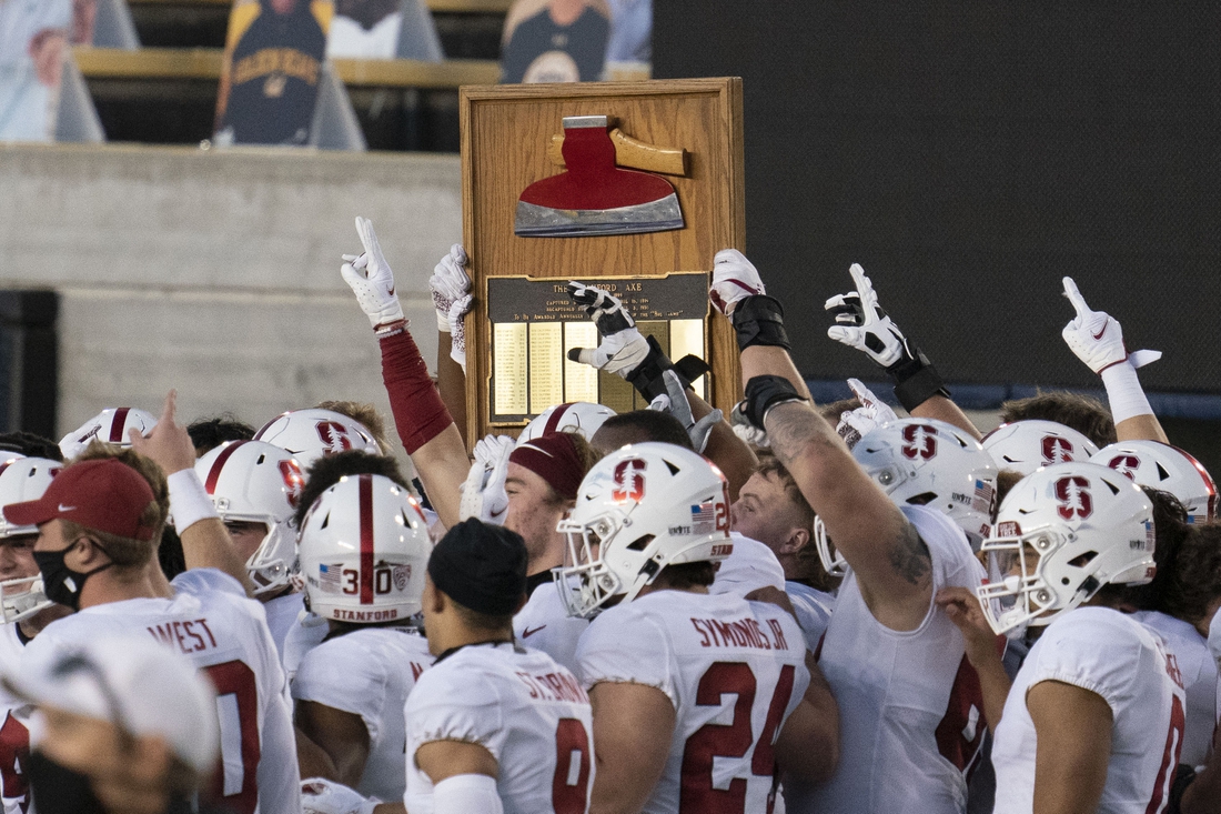 November 27, 2020; Berkeley, California, USA; Stanford Cardinal players celebrate with The Stanford Axe after the game against the California Golden Bears at California Memorial Stadium. Mandatory Credit: Kyle Terada-USA TODAY Sports