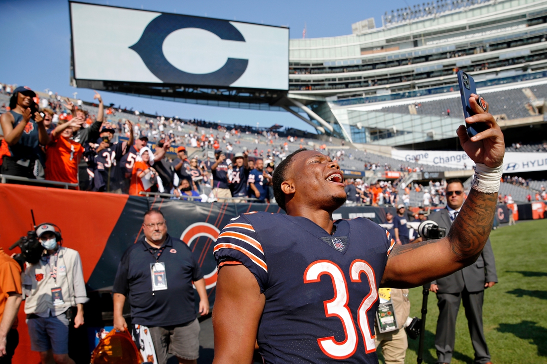 Sep 19, 2021; Chicago, Illinois, USA; Chicago Bears running back David Montgomery (32) celebrates with fans after their 20-17 win over the Cincinnati Bengals at Soldier Field. Mandatory Credit: Jon Durr-USA TODAY Sports