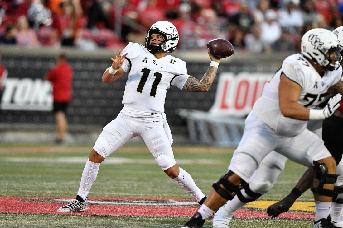 Sep 17, 2021; Louisville, Kentucky, USA;  UCF Knights quarterback Dillon Gabriel (11) looks to pass against the Louisville Cardinals during the first quarter at Cardinal Stadium. Louisville defeated Central Florida 42-35. Mandatory Credit: Jamie Rhodes-USA TODAY Sports