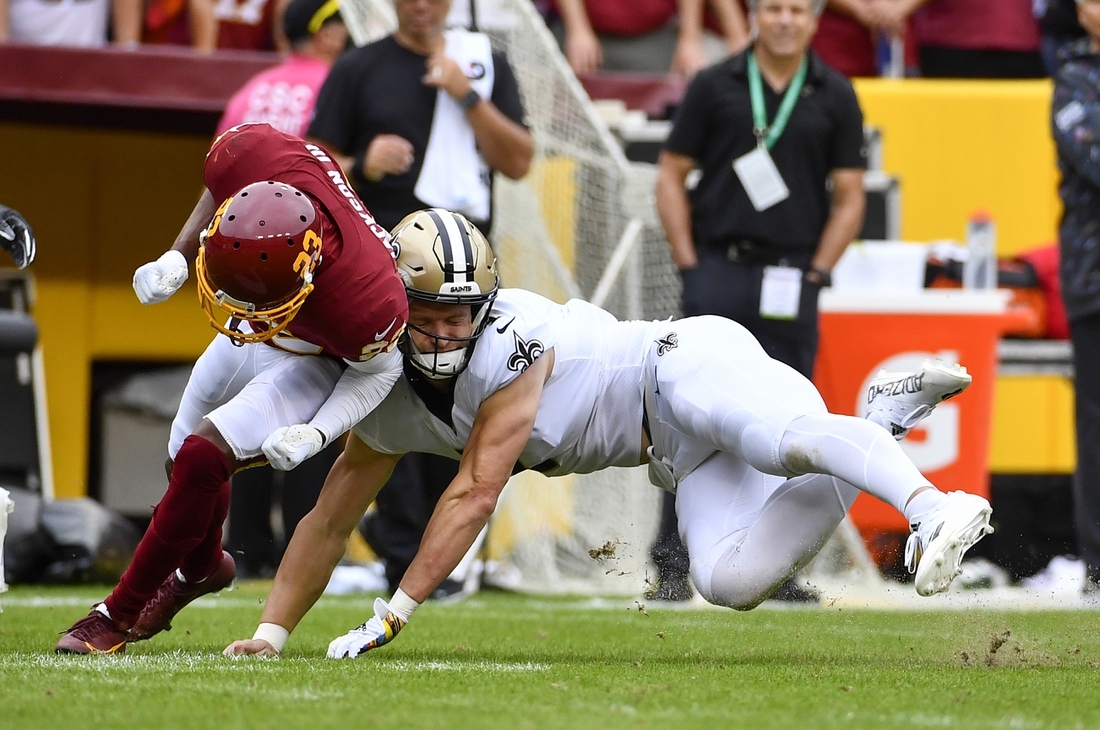 Oct 10, 2021; Landover, Maryland, USA; New Orleans Saints wide receiver Taysom Hill (7) suffers and apparent neck injury against the Washington Football Team during the first half at FedExField. Mandatory Credit: Brad Mills-USA TODAY Sports