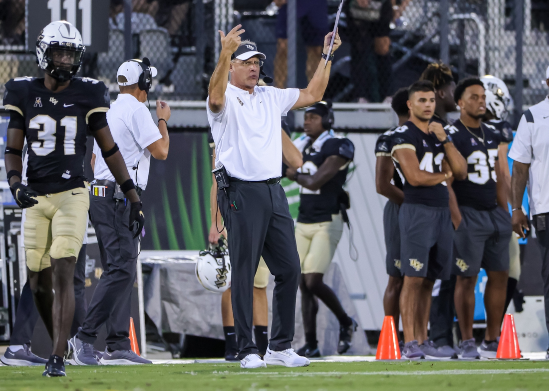 Oct 9, 2021; Orlando, Florida, USA; UCF Knights head coach Gus Malzahn calls his team to the sideline during the first quarter against the East Carolina Pirates at Bounce House. Mandatory Credit: Mike Watters-USA TODAY Sports