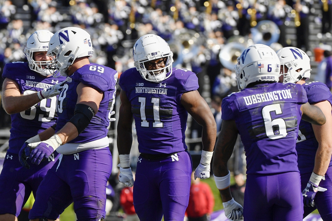 Oct 16, 2021; Evanston, Illinois, USA; Northwestern Wildcats running back Andrew Clair (11) reacts after scoring a touchdown in the second half against the Rutgers Scarlet Knights at Ryan Field. Mandatory Credit: Quinn Harris-USA TODAY Sports