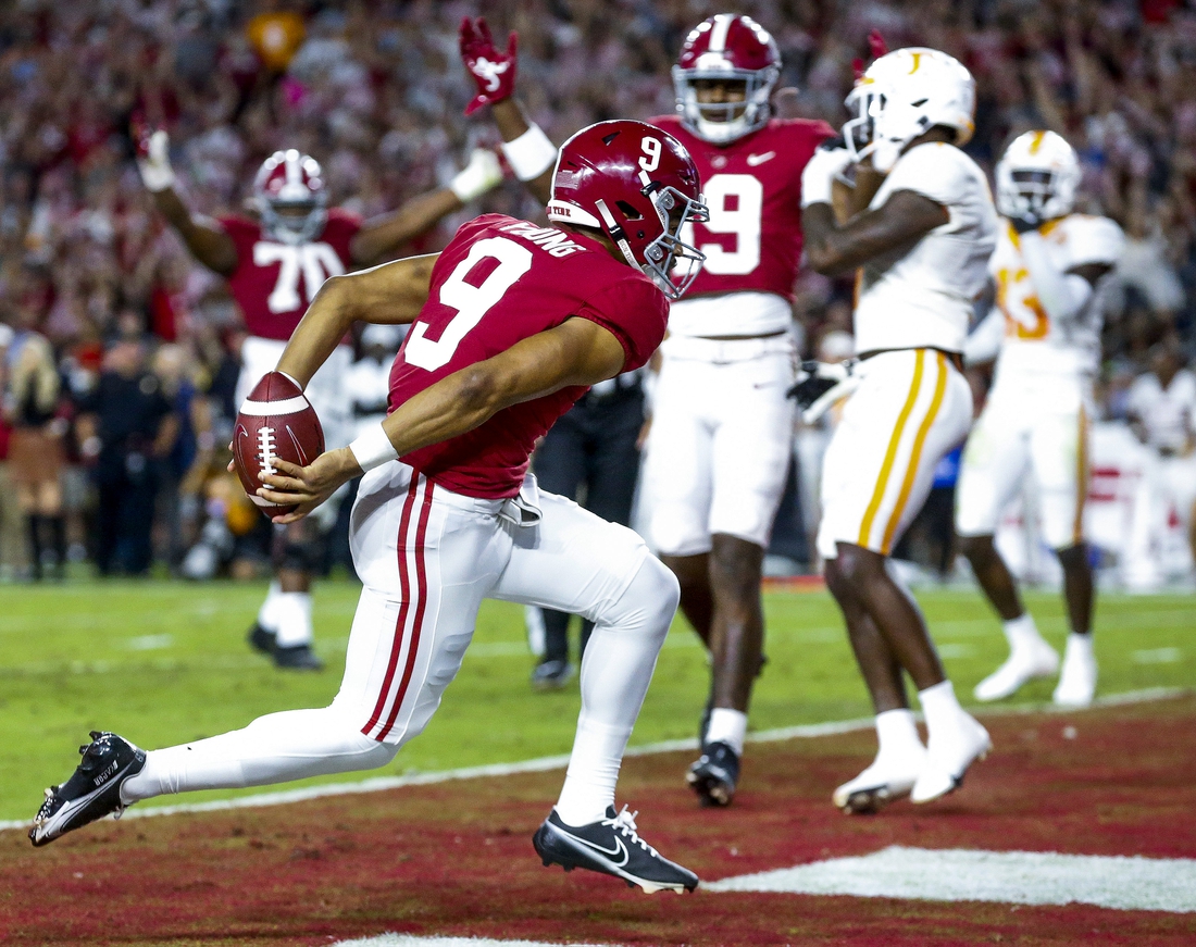 Oct 23, 2021; Tuscaloosa, Alabama, USA;  Alabama Crimson Tide quarterback Bryce Young (9) crosses the goal line to score a touchdown against the Tennessee Volunteers during the first half at Bryant-Denny Stadium. Mandatory Credit: Gary Cosby Jr.-USA TODAY Sports