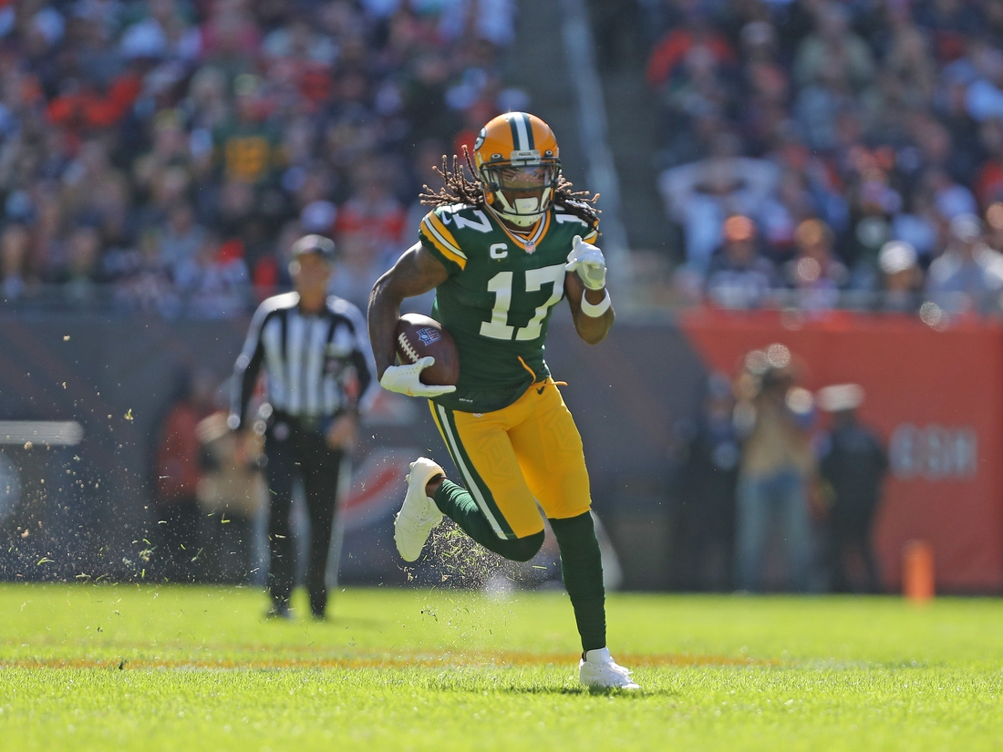 Oct 17, 2021; Chicago, Illinois, USA; Green Bay Packers wide receiver Davante Adams (17) runs with the ball during the first half against the Chicago Bears at Soldier Field. Mandatory Credit: Dennis Wierzbicki-USA TODAY Sports