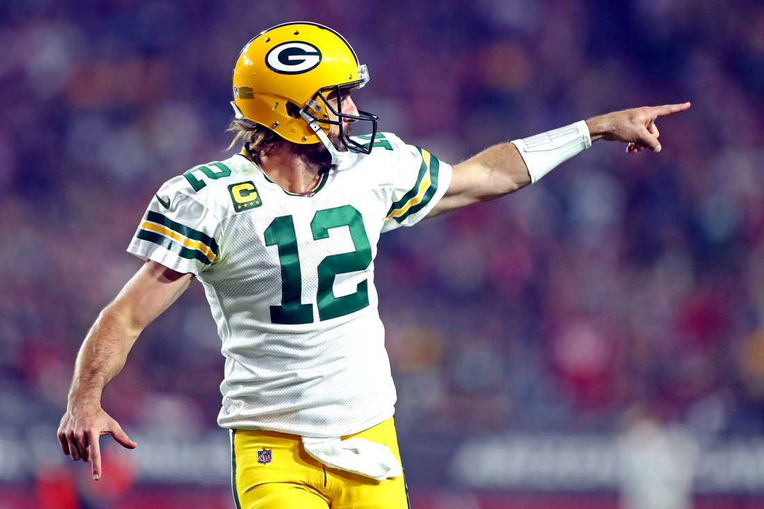 Oct 28, 2021; Glendale, Arizona, USA; Green Bay Packers quarterback Aaron Rodgers (12) celebrates after a play during the second half against the Arizona Cardinals at State Farm Stadium. Mandatory Credit: Mark J. Rebilas-USA TODAY Sports