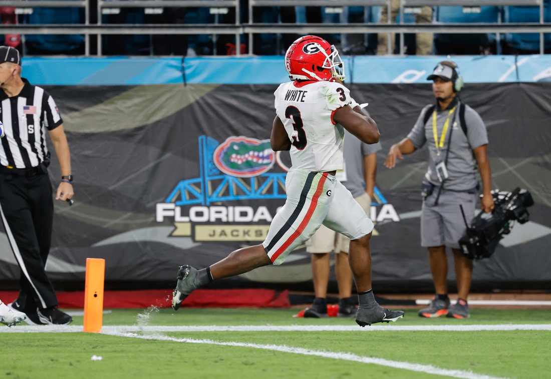 Oct 30, 2021; Jacksonville, Florida, USA; Georgia Bulldogs running back Zamir White (3) scores a touchdown against the Florida Gators during the second half at TIAA Bank Field. Mandatory Credit: Kim Klement-USA TODAY Sports