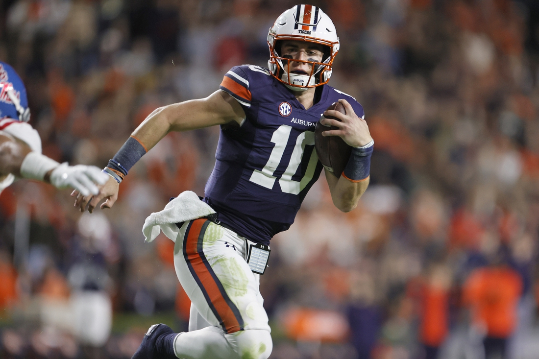 Oct 30, 2021; Auburn, Alabama, USA;  Auburn Tigers quarterback Bo Nix (10) carries the ball for a touchdown against the Mississippi Rebels during the first quarter at Jordan-Hare Stadium.  Mandatory Credit: John Reed-USA TODAY Sports
