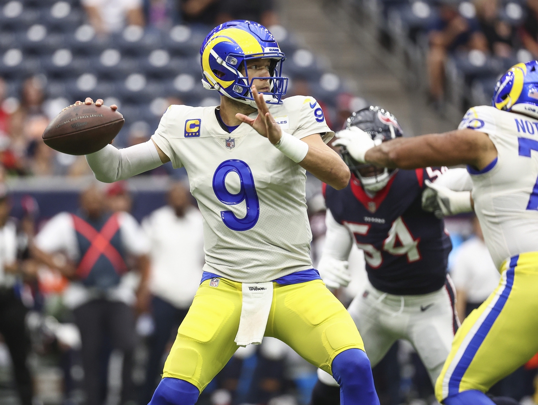 Oct 31, 2021; Houston, Texas, USA; Los Angeles Rams quarterback Matthew Stafford (9) attempts a pass during the first quarter against the Houston Texans at NRG Stadium. Mandatory Credit: Troy Taormina-USA TODAY Sports