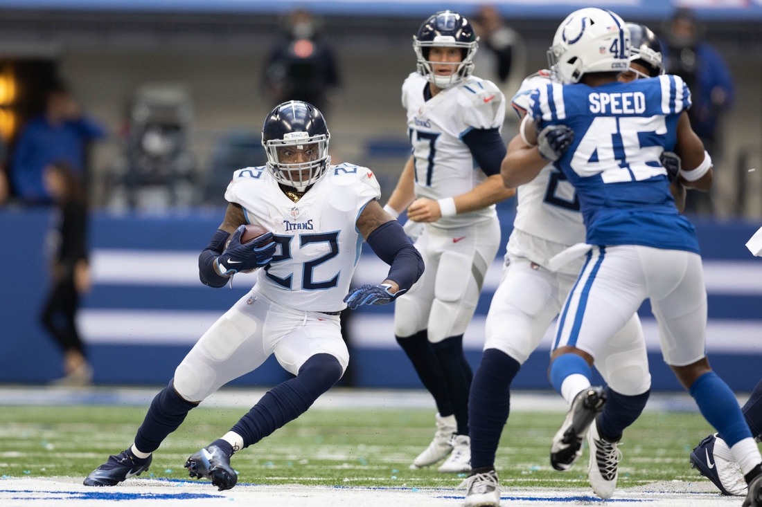 Oct 31, 2021; Indianapolis, Indiana, USA; Tennessee Titans running back Derrick Henry (22) runs the ball  in the second half against the Indianapolis Colts at Lucas Oil Stadium. Mandatory Credit: Trevor Ruszkowski-USA TODAY Sports