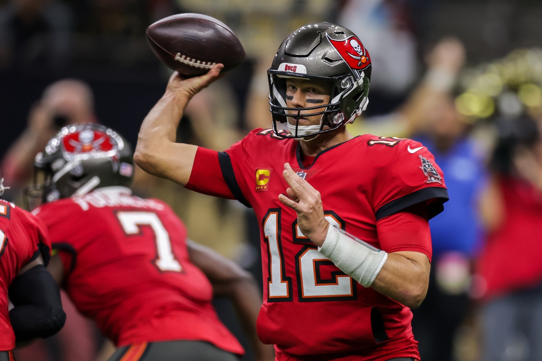 Oct 31, 2021; New Orleans, Louisiana, USA;  Tampa Bay Buccaneers quarterback Tom Brady (12) looks to pass the ball against New Orleans Saints during the second half at Caesars Superdome. Mandatory Credit: Stephen Lew-USA TODAY Sports