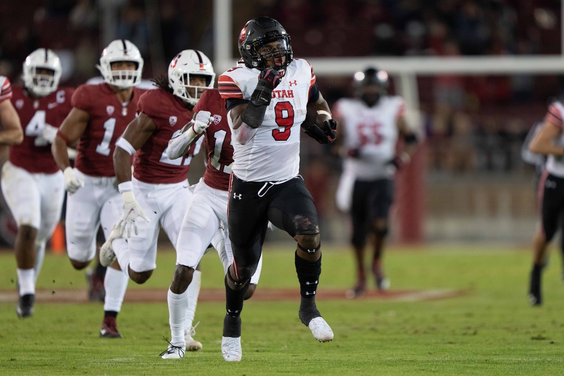 Nov 5, 2021; Stanford, California, USA;  Utah Utes running back Tavion Thomas (9) runs with the ball during the second quarter against the Stanford Cardinal at Stanford Stadium. Mandatory Credit: Stan Szeto-USA TODAY Sports