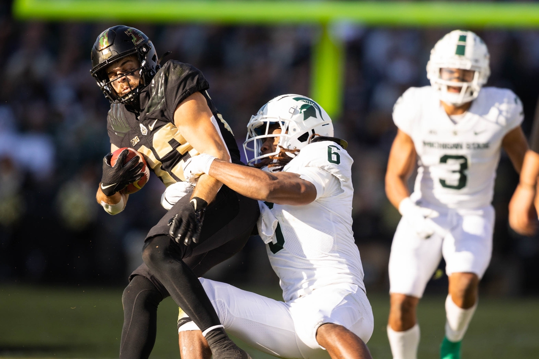 Nov 6, 2021; West Lafayette, Indiana, USA; Purdue Boilermakers wide receiver Jackson Anthrop (33) runs the ball while Michigan State Spartans linebacker Quavaris Crouch (6) defends in the first half at Ross-Ade Stadium. Mandatory Credit: Trevor Ruszkowski-USA TODAY Sports