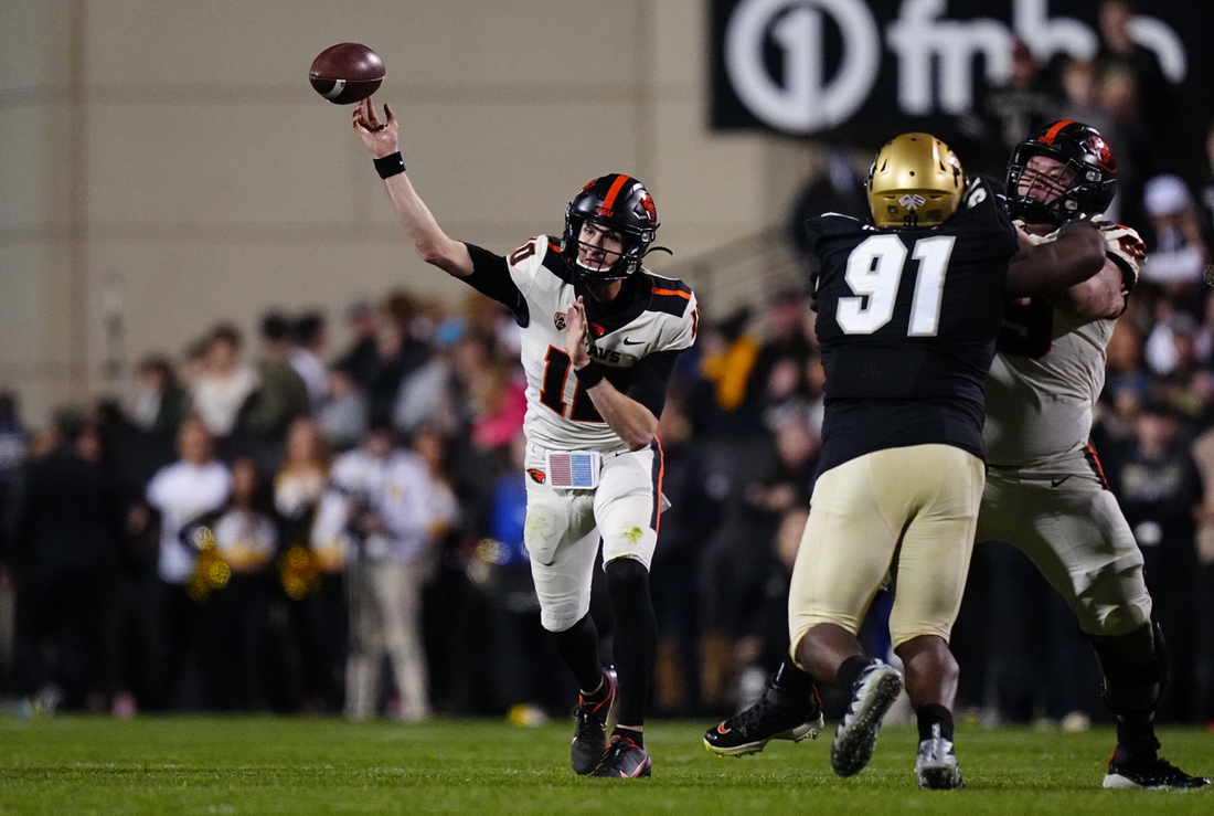 Nov 6, 2021; Boulder, Colorado, USA; Oregon State Beavers quarterback Chance Nolan (10) passes the ball in overtime against the Colorado Buffaloes at Folsom Field. Mandatory Credit: Ron Chenoy-USA TODAY Sports