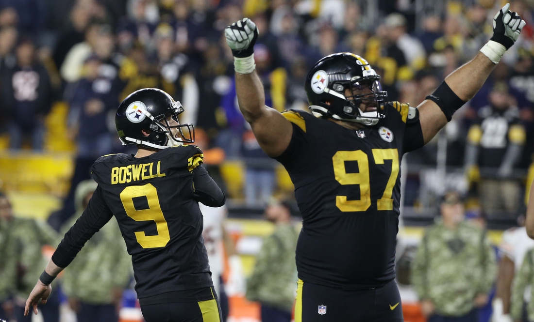 Nov 8, 2021; Pittsburgh, Pennsylvania, USA;  Pittsburgh Steelers defensive end Cameron Heyward (97) reacts after kicker Chris Boswell (9) kicks a game winning field goal against the Chicago Bears at Heinz Field. Pittsburgh won 29-27. Mandatory Credit: Charles LeClaire-USA TODAY Sports