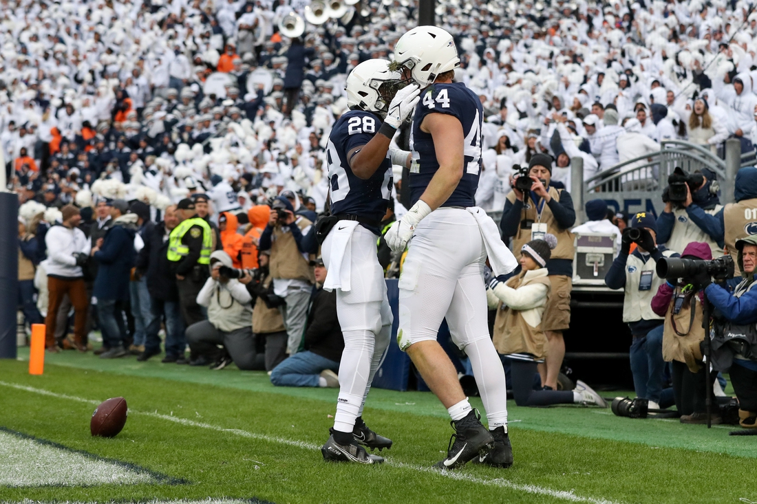 Nov 13, 2021; University Park, Pennsylvania, USA; Penn State Nittany Lions tight end Tyler Warren (44) celebrates with running back Devyn Ford (28) after scoring a touchdown during the fourth quarter against the Michigan Wolverines at Beaver Stadium. Michigan defeated Penn State 21-17. Mandatory Credit: Matthew OHaren-USA TODAY Sports