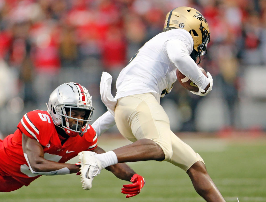 Ohio State Buckeyes cornerback Marcus Williamson (5) can't come up with the tackle of Purdue Boilermakers wide receiver David Bell (3) after a catch during the 1st quarter of their NCAA game at Ohio Stadium in Columbus, Ohio on November 13, 2021.

Osu21pur Kwr 08