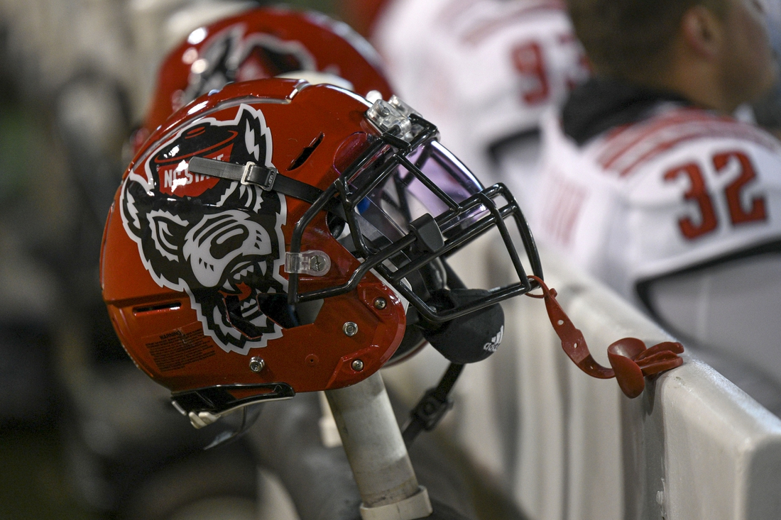 Nov 13, 2021; Winston-Salem, North Carolina, USA; A North Carolina State Wolfpack helmet seen on the sideline during the second half against the Wake Forest Demon Deacons at Truist Field. Mandatory Credit: William Howard-USA TODAY Sports