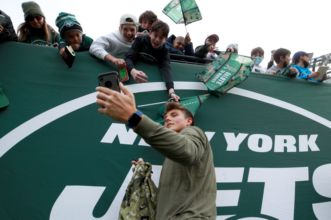 Nov 14, 2021; East Rutherford, New Jersey, USA; New York Jets quarterback Zach Wilson (2) takes selfies with fans before a game against the Buffalo Bills at MetLife Stadium. Mandatory Credit: Brad Penner-USA TODAY Sports