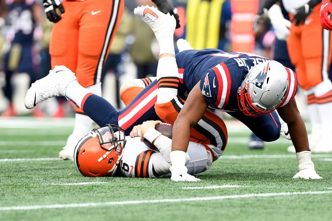 Nov 14, 2021; Foxborough, Massachusetts, USA; New England Patriots defensive end Deatrich Wise (91) sacks Cleveland Browns quarterback Baker Mayfield (6) during the second half at Gillette Stadium. Mandatory Credit: Brian Fluharty-USA TODAY Sports