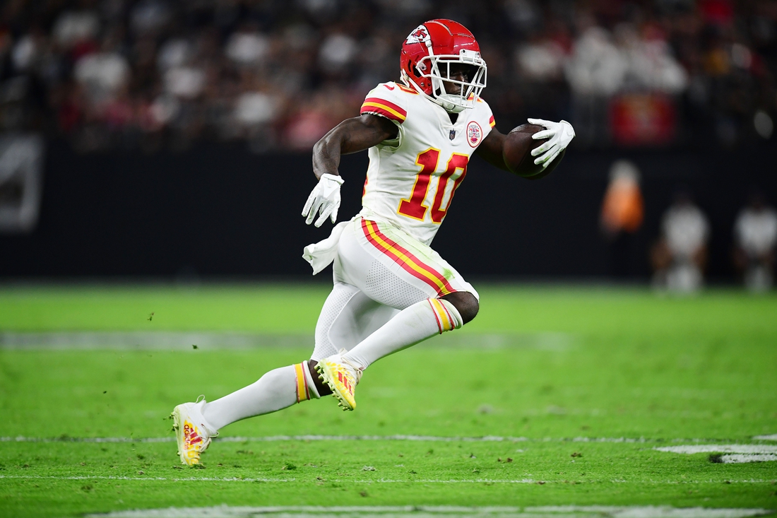 Nov 14, 2021; Paradise, Nevada, USA; Kansas City Chiefs wide receiver Tyreek Hill (10) runs the ball against the Las Vegas Raiders during the first half at Allegiant Stadium. Mandatory Credit: Gary A. Vasquez-USA TODAY Sports