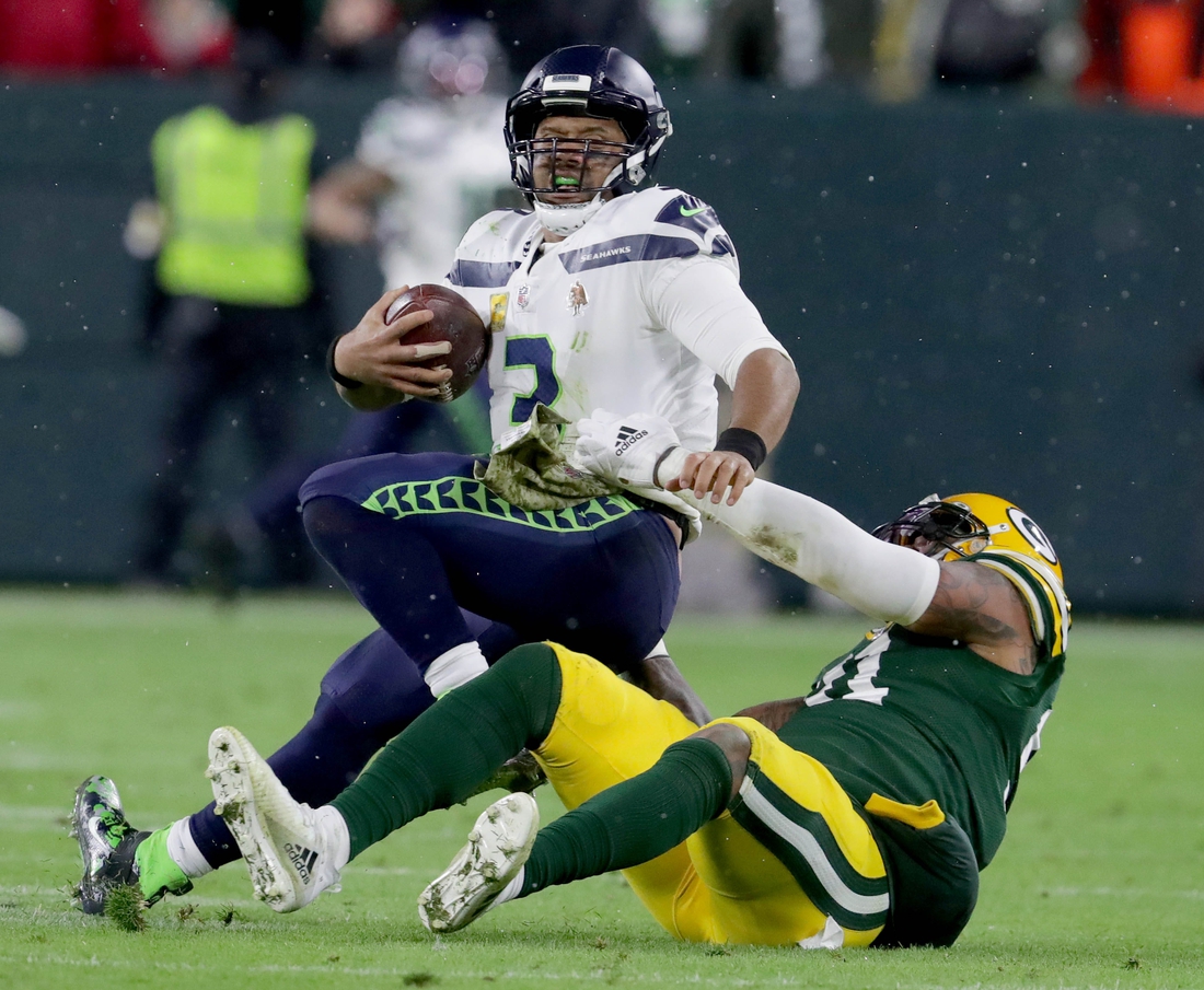 Seattle Seahawks quarterback Russell Wilson (3) is sacked by Green Bay Packers outside linebacker Preston Smith (91) late in the 4th quarter of the 17-0 win at Lambeau Field in Green Bay on Sunday, Nov. 14, 2021.   Photo by Mike De Sisti / Milwaukee Journal Sentinel via USA TODAY NETWORK
