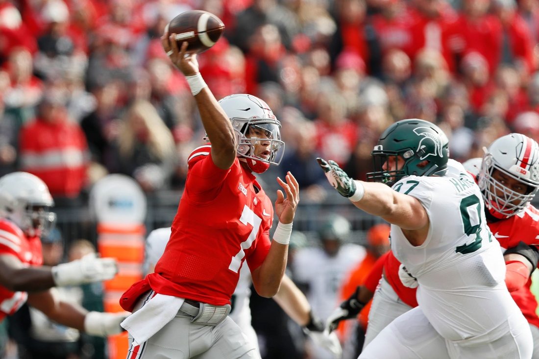 Ohio State Buckeyes quarterback C.J. Stroud (7) throws over Michigan State Spartans defensive tackle Maverick Hansen (97) during the first quarter of the NCAA football game at Ohio Stadium in Columbus on Saturday, Nov. 20, 2021.

Michigan State Spartans At Ohio State Buckeyes Football