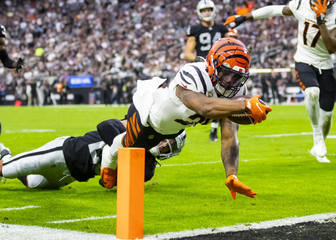 Nov 21, 2021; Paradise, Nevada, USA; Cincinnati Bengals running back Joe Mixon (28) dives into the end zone to score a touchdown against the Las Vegas Raiders in the first half at Allegiant Stadium. Mandatory Credit: Mark J. Rebilas-USA TODAY Sports
