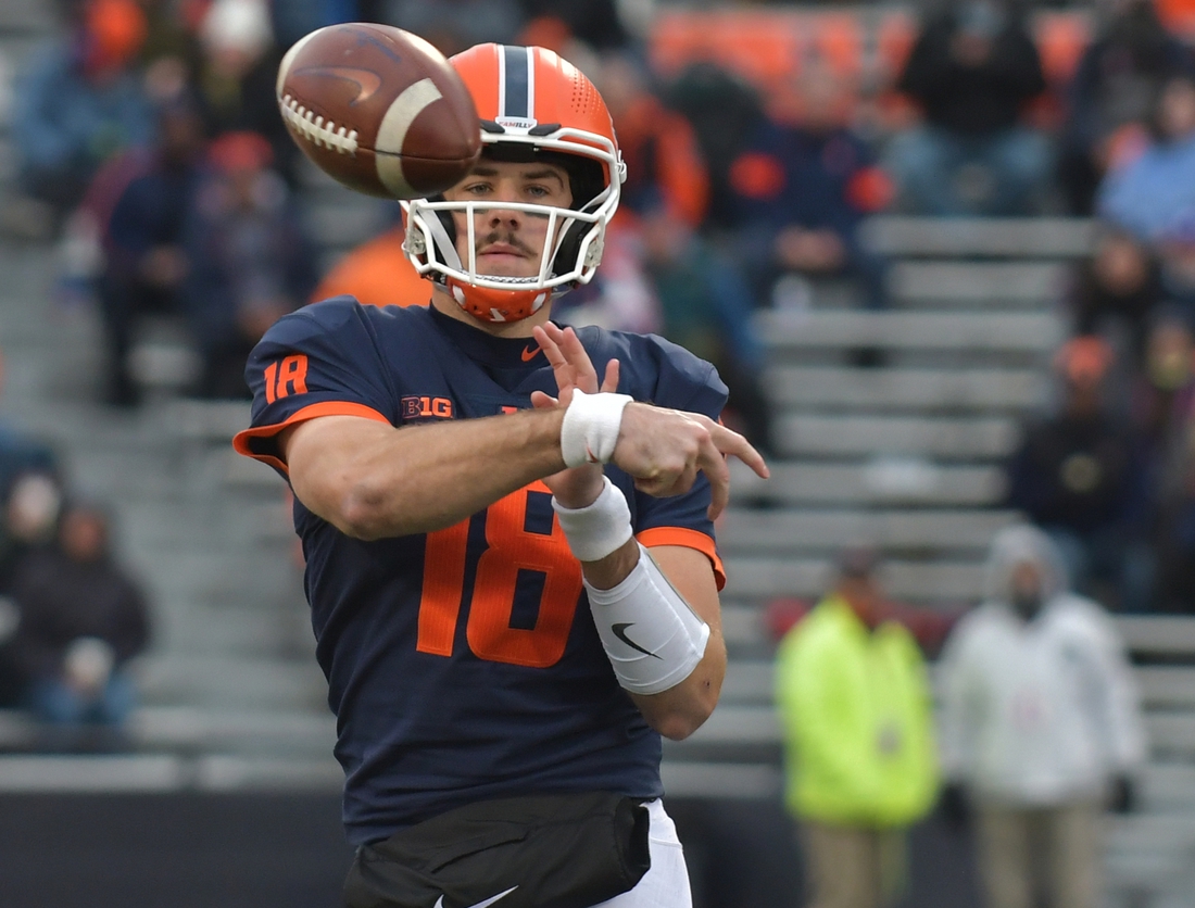 Nov 27, 2021; Champaign, Illinois, USA;  Illinois Fighting Illini quarterback Brandon Peters (18) passes  the ball during the first half against the Northwestern Wildcats  at Memorial Stadium. Mandatory Credit: Ron Johnson-USA TODAY Sports