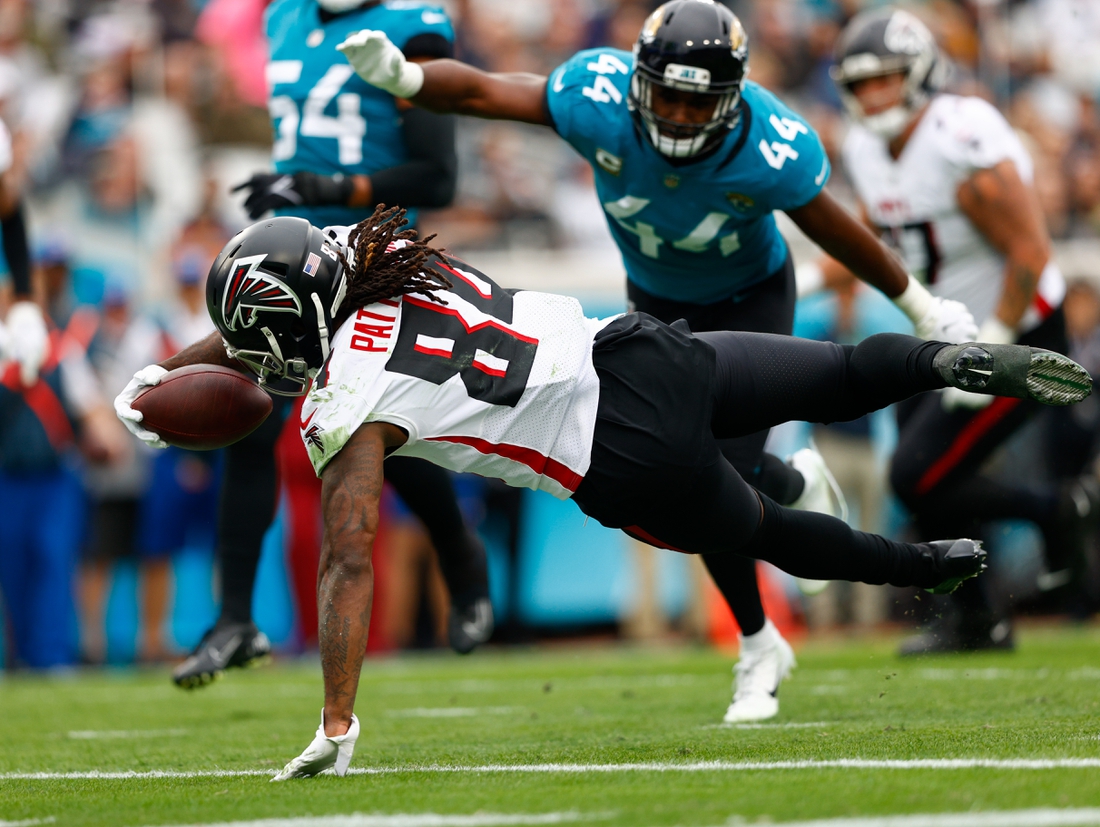 Nov 28, 2021; Jacksonville, Florida, USA;  Atlanta Falcons running back Cordarrelle Patterson (84) dives into the end zone for a touchdown in the first half against the Jacksonville Jaguars at TIAA Bank Field. Mandatory Credit: Nathan Ray Seebeck-USA TODAY Sports