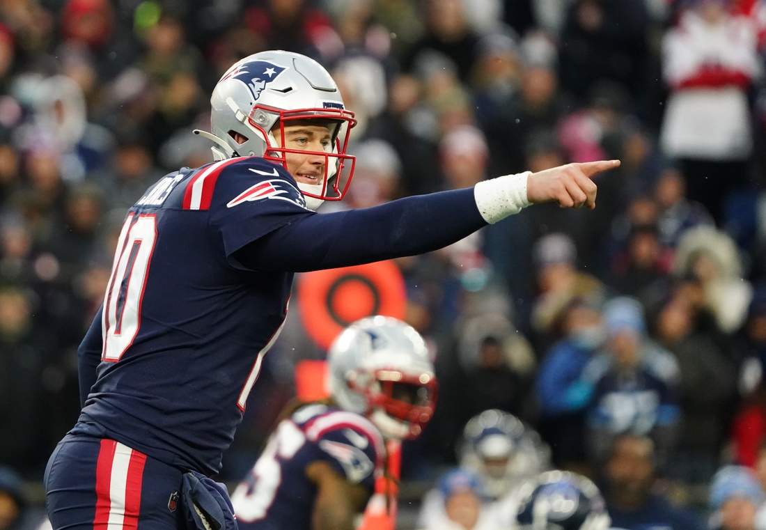 Nov 28, 2021; Foxborough, Massachusetts, USA; New England Patriots quarterback Mac Jones (10) on the line of scrimmage against the Tennessee Titans in the second half at Gillette Stadium. Mandatory Credit: David Butler II-USA TODAY Sports