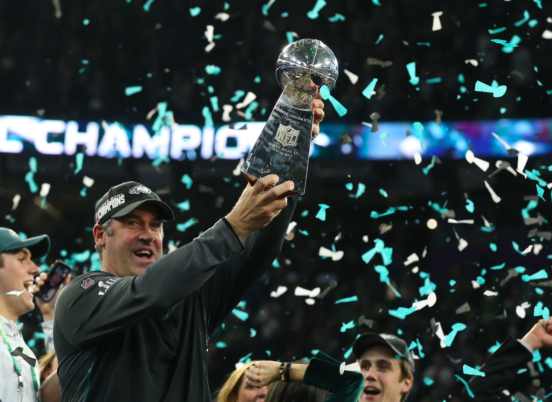 Feb 4, 2018; Minneapolis, MN, USA; Philadelphia Eagles head coach Doug Pederson hoist the Vince Lombardi Trophy after a victory against the New England Patriots in Super Bowl LII at U.S. Bank Stadium. Mandatory Credit: Matthew Emmons-USA TODAY Sports