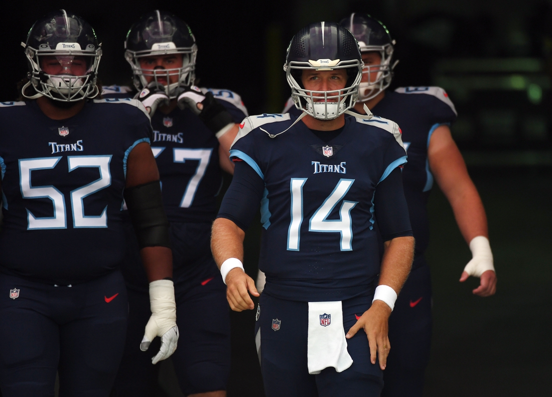 Aug 28, 2021; Nashville, TN, USA; Tennessee Titans quarterback Matt Barkley (14) walks out with offensive linemen before the game against the Chicago Bears at Nissan Stadium. Mandatory Credit: Christopher Hanewinckel-USA TODAY Sports