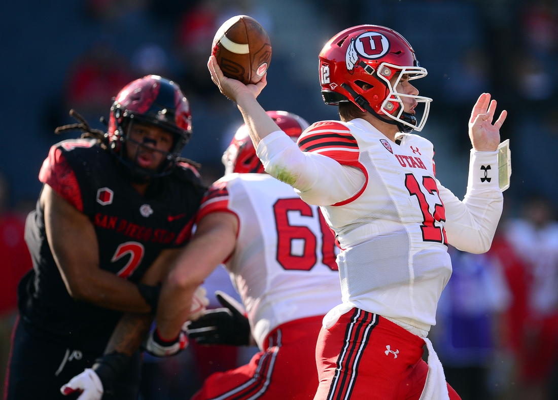 Sep 18, 2021; Carson, California, USA; Utah Utes quarterback Charlie Brewer (12) throws against the San Diego State Aztecs during the first half at Dignity Health Sports Park. Mandatory Credit: Gary A. Vasquez-USA TODAY Sports
